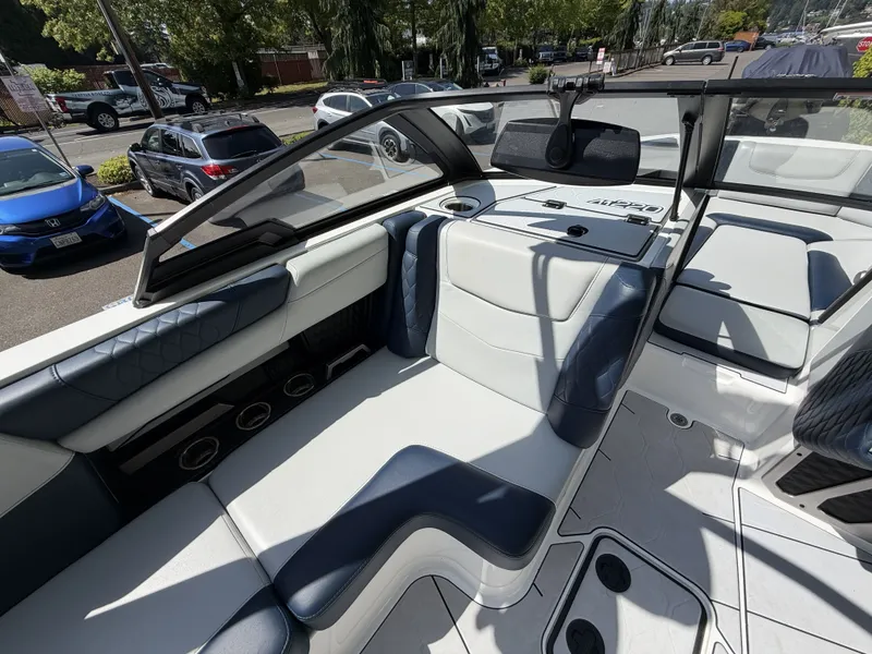Slide: The Image of Interior of a 2022 Malibu M220 boat with luxurious seating. - 13