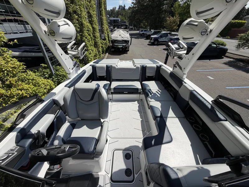 Slide: The Image of Interior of 2022 Malibu M220 boat with luxurious seating. - 16