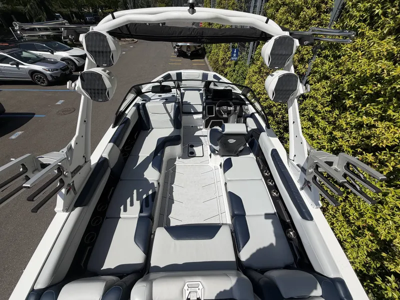 Slide: The Image of Interior view of a 2022 Malibu M220 boat with luxurious seating. - 9