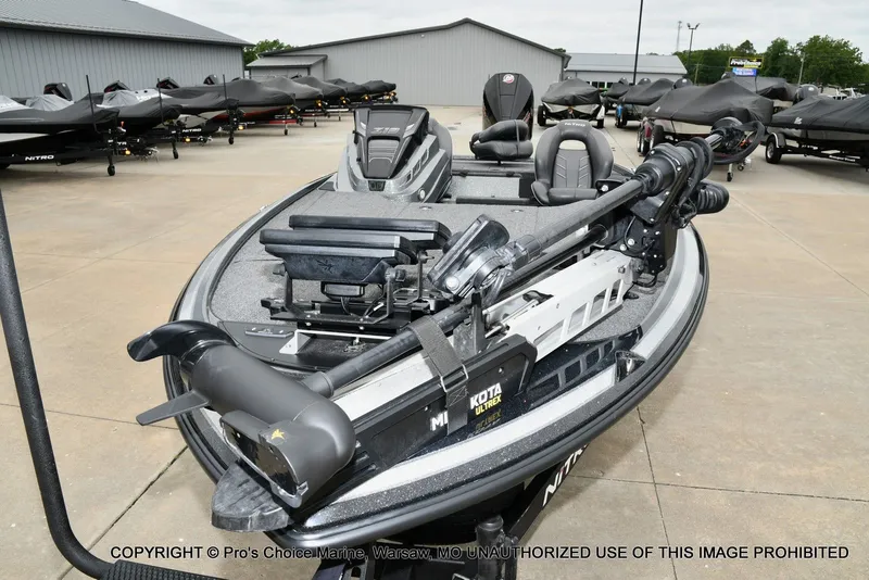 Slide: The Image of 2020 Nitro Z19 Pro boat displayed in a parking lot. - 30
