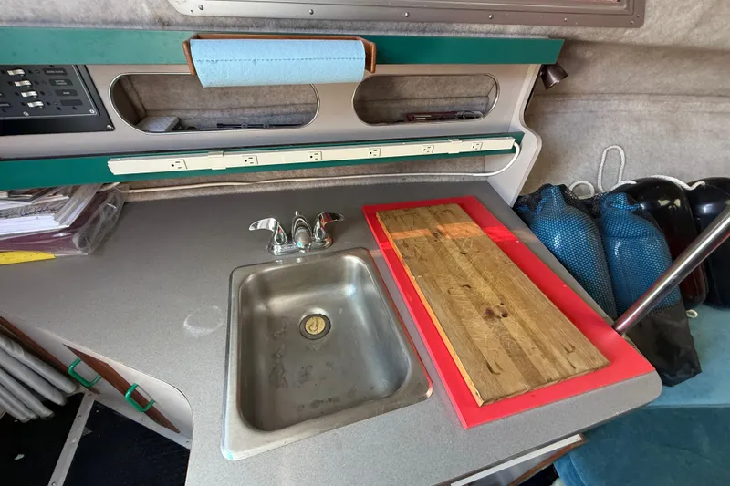 Slide: The Image of 1988 Cruisers Yachts 2470 Holiday interior with sink and countertop setup. - 12