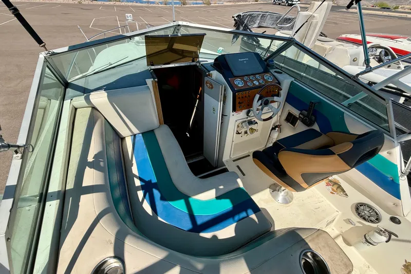 Slide: The Image of 1988 Cruisers Yachts 2470 Holiday boat interior with seating and control panel. - 20