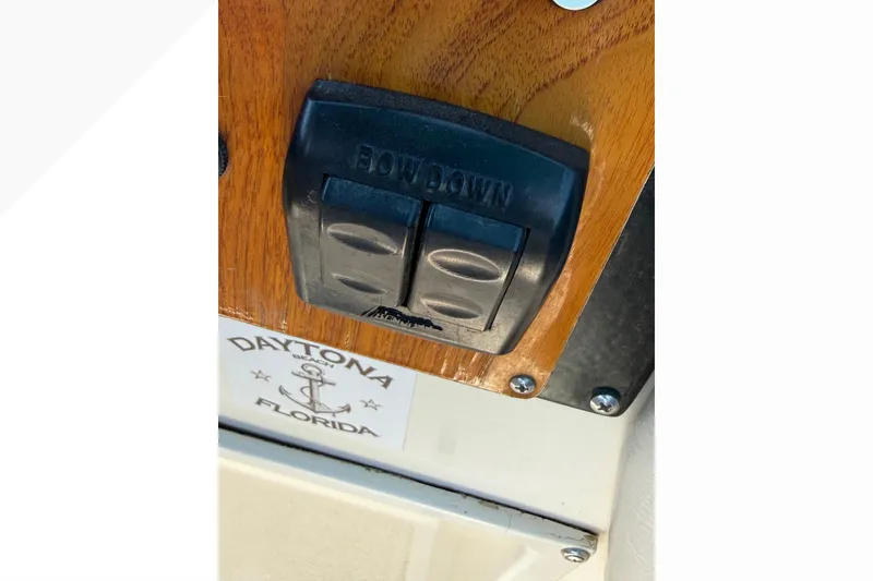 Slide: The Image of Control panel on 1988 Cruisers Yachts 2470 Holiday, featuring "Bow Down" switch, Daytona Beach label. - 27