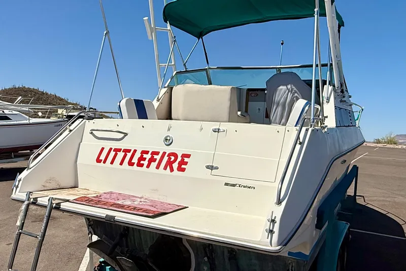 Slide: The Image of 1988 Cruisers Yachts 2470 Holiday boat named "LITTLEFIRE" on trailer, sunny day. - 3