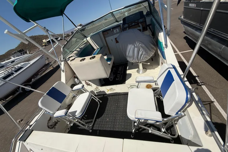 Slide: The Image of 1988 Cruisers Yachts 2470 Holiday boat interior with seating and steering area. - 33