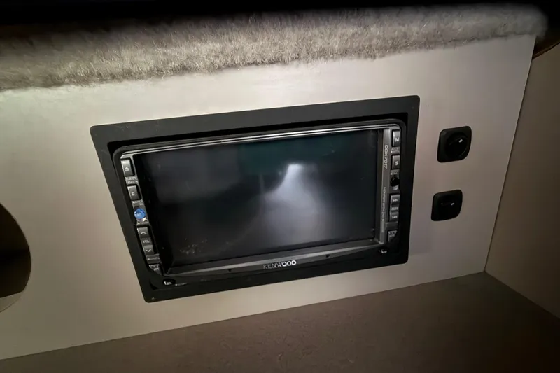 Slide: The Image of Kenwood stereo system in 1988 Cruisers Yachts 2470 Holiday cabin interior. - 9