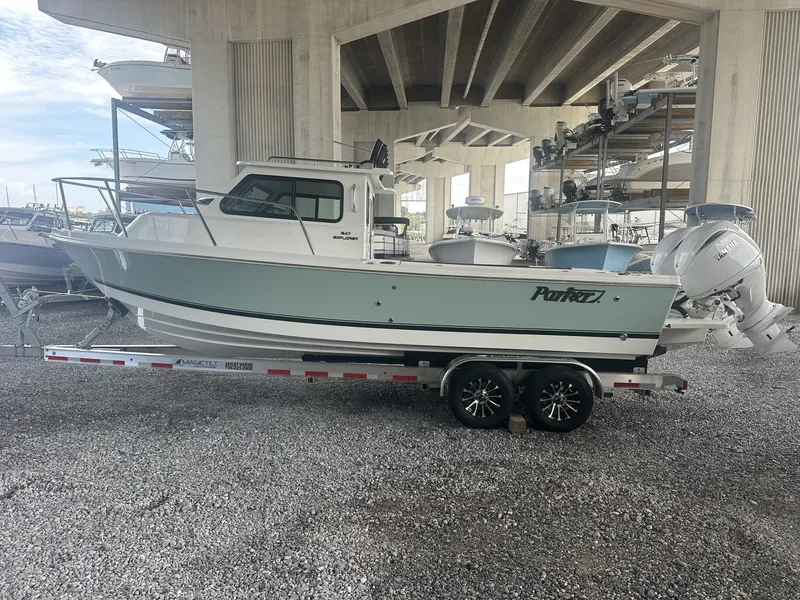 Slide: The Image of Parker 247 Explorer 2026 on trailer parked under bridge. - 5