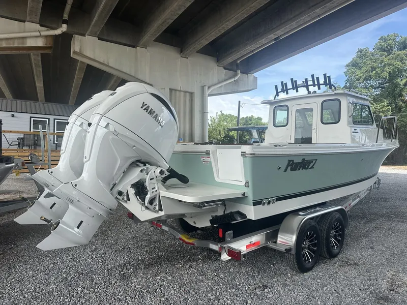 Slide: The Image of 2026 Parker 247 Explorer with Yamaha engines under bridge. - 7