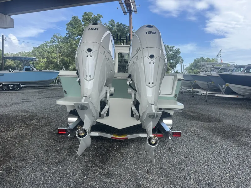 Slide: The Image of Parker 247 Explorer 2026 with twin 150 HP engines, parked outdoors. - 6