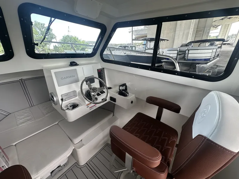 Slide: The Image of Interior of 2026 Parker 247 Explorer with Garmin controls. - 8