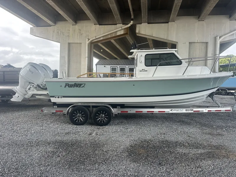The Image of Parker 247 Explorer boat 2026 on trailer under bridge. - 1
