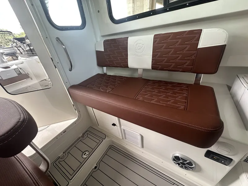 Slide: The Image of Interior of 2026 Parker 247 Explorer with brown leather seating. - 9