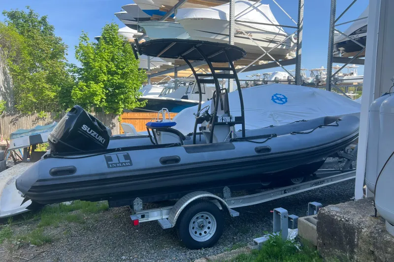 The Image of 2023 Inmar 600R-PT inflatable boat on trailer with Suzuki outboard motor. - 0