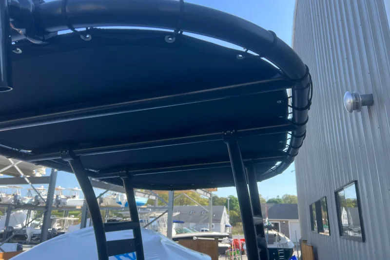 Slide: The Image of 2023 Inmar 600R-PT boat canopy, black frame, outdoor setting. - 13