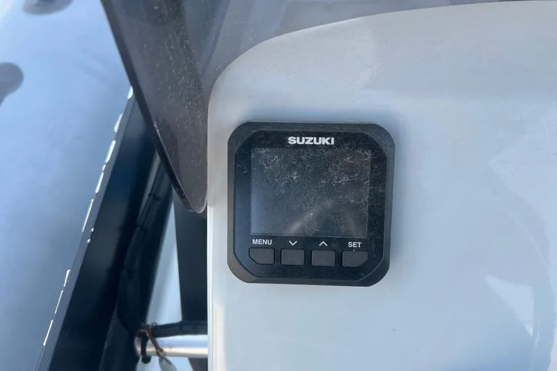 Slide: The Image of Close-up of Suzuki control panel on 2023 Inmar 600R-PT boat. - 20