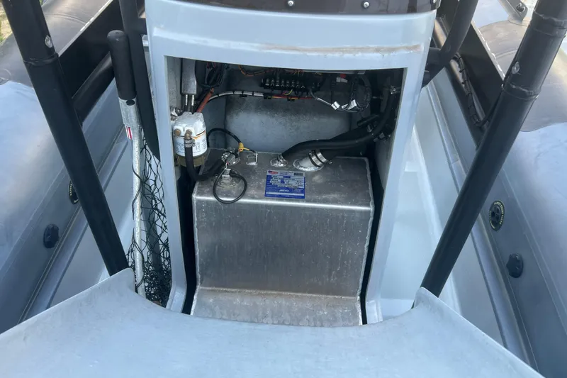 Slide: The Image of 2023 Inmar 600R-PT boat interior showing storage compartment and equipment. - 21