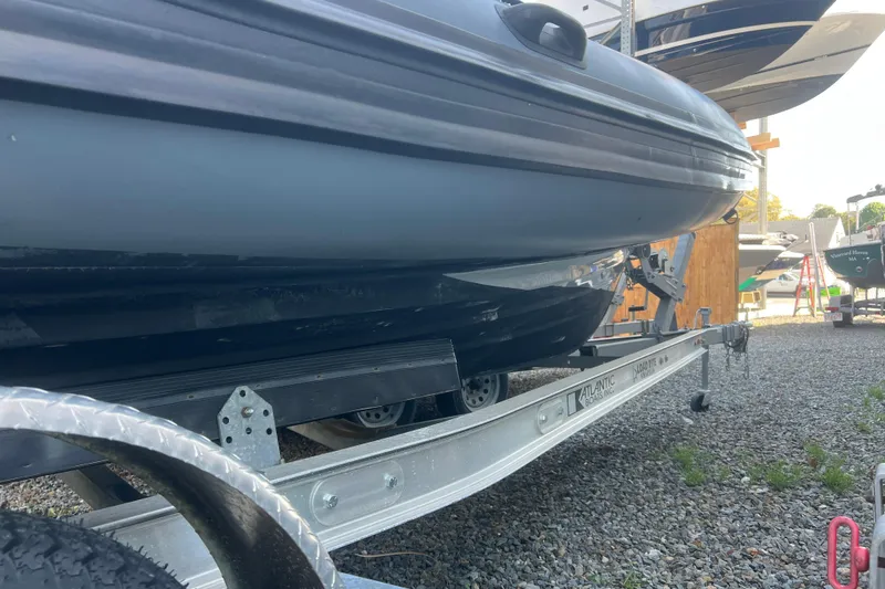 Slide: The Image of 2023 Inmar 600R-PT boat on trailer, parked on gravel lot. - 23