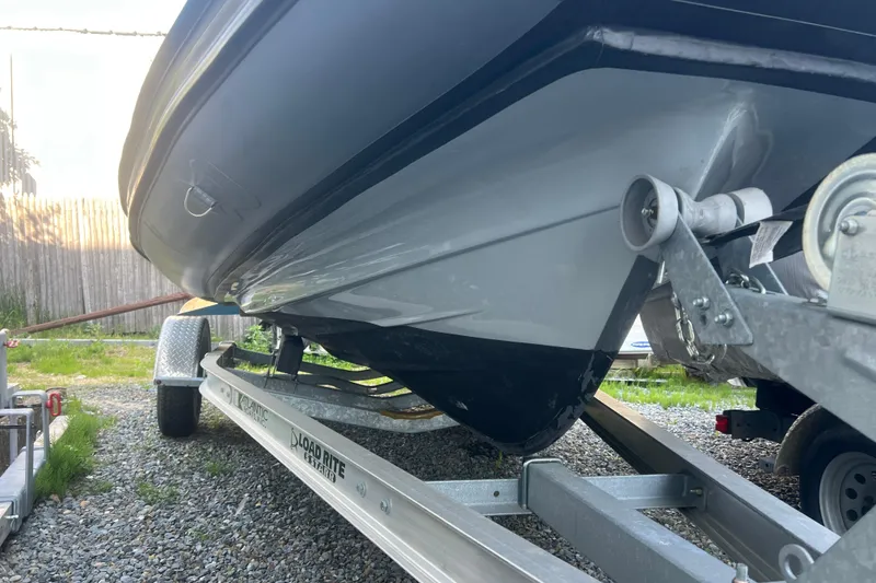 Slide: The Image of 2023 Inmar 600R-PT boat on trailer, showcasing hull design and trailer details. - 25