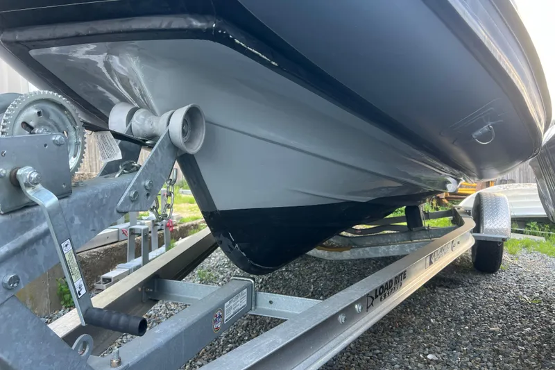 Slide: The Image of 2023 Inmar 600R-PT boat on trailer, showcasing hull and trailer details. - 26