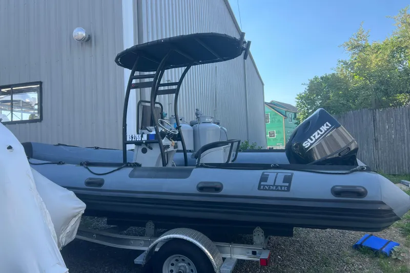 Slide: The Image of 2023 Inmar 600R-PT inflatable boat with Suzuki outboard motor on trailer. - 3