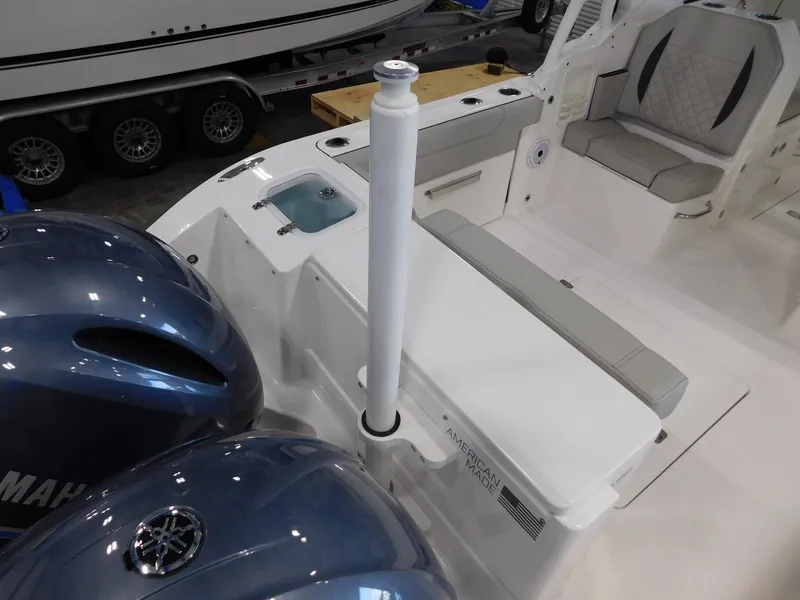 Slide: The Image of 2022 Pursuit DC 266 Dual Console boat interior with Yamaha engines. - 11
