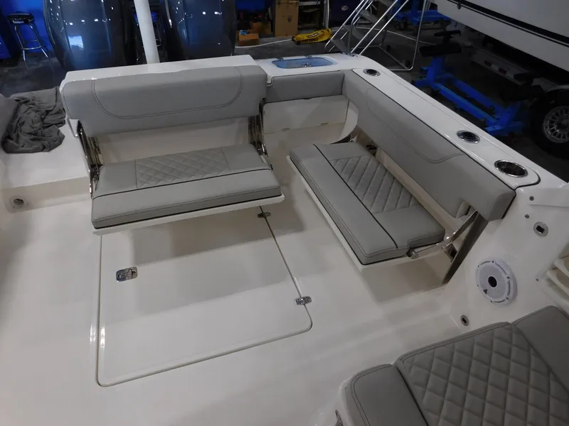 Slide: The Image of Interior of 2022 Pursuit DC 266 Dual Console with gray upholstered seating. - 16