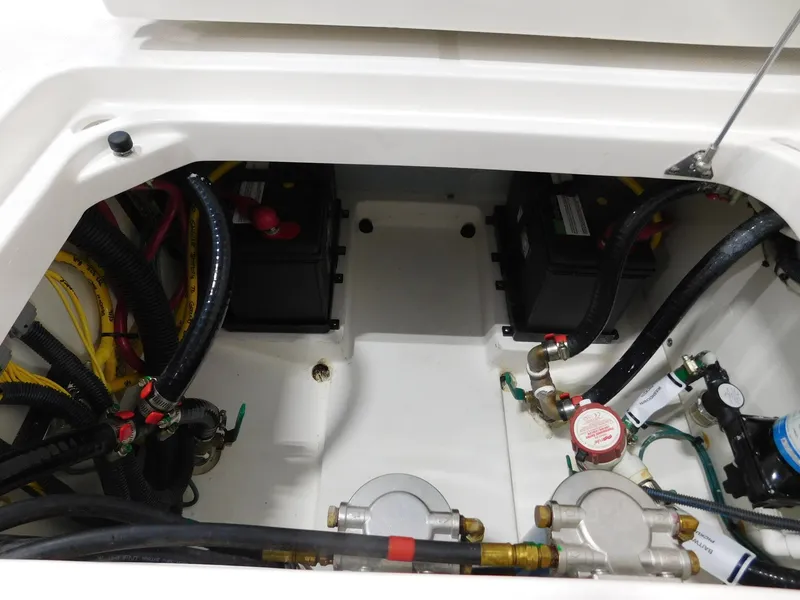 Slide: The Image of Engine compartment of 2022 Pursuit DC 266 Dual Console with batteries and wiring. - 20