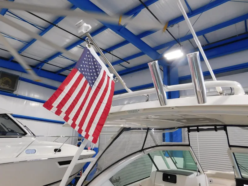 Slide: The Image of Pursuit DC 266 Dual Console 2022 with American flag indoors. - 23