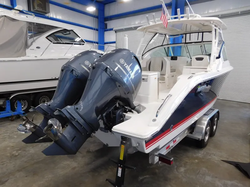 Slide: The Image of 2022 Pursuit DC 266 Dual Console boat with twin outboard engines. - 3