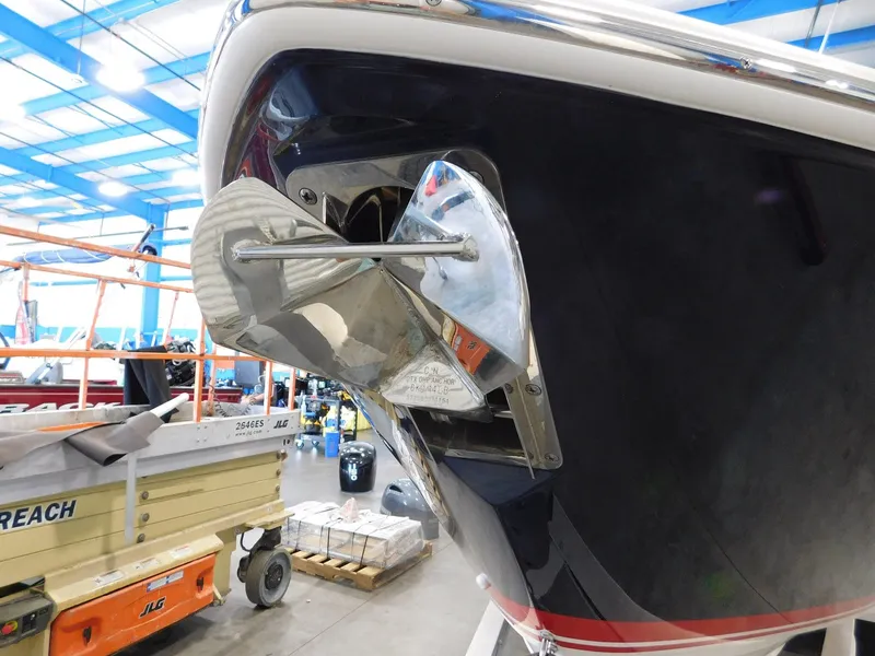 Slide: The Image of 2022 Pursuit DC 266 Dual Console anchor in warehouse. - 5