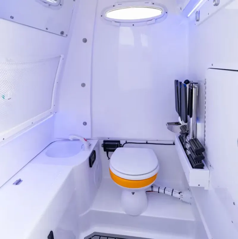 Slide: The Image of Interior of Sea Hunt Ultra 285 SE 2026 with toilet and sink. - 17