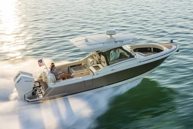 Slide: The Image of Manufacturer Provided Image: 2025 Chris-Craft Calypso 32 cruising swiftly on open water. - 1