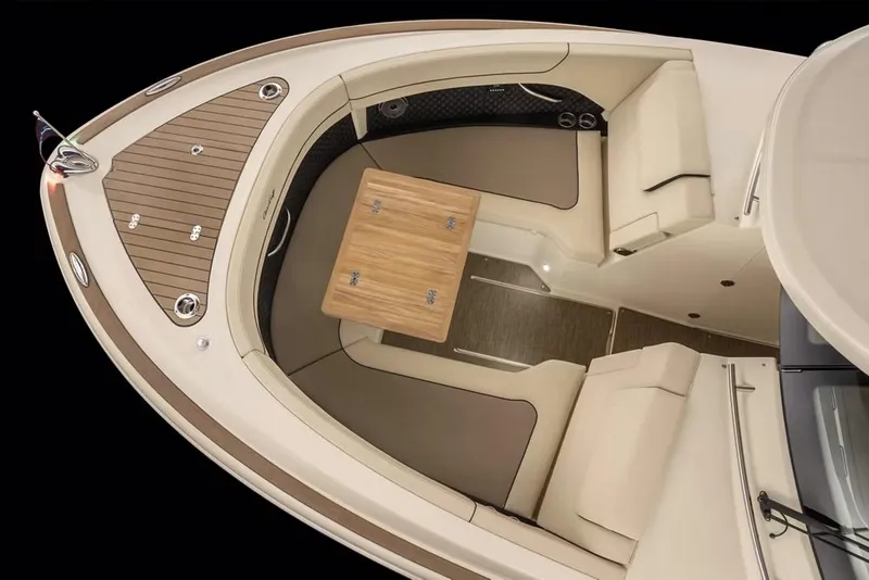 Slide: The Image of Manufacturer Provided Image: 2025 Chris-Craft Calypso 32 boat interior with elegant seating and wooden table. - 4