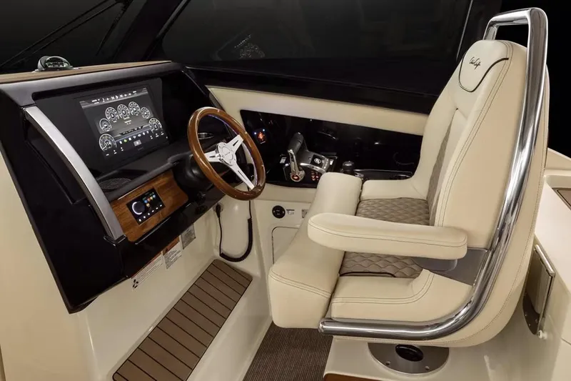 Slide: The Image of Manufacturer Provided Image: Luxurious helm of 2025 Chris-Craft Calypso 32 with leather seating and advanced controls. - 5