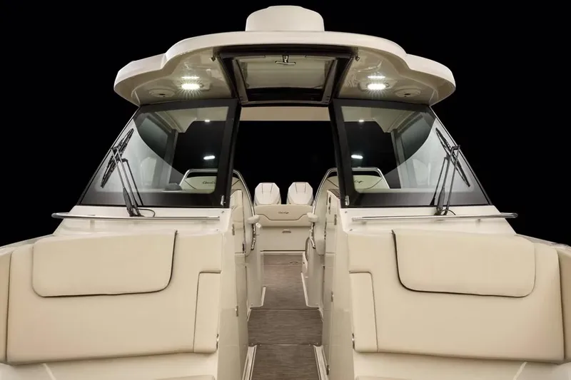 Slide: The Image of Manufacturer Provided Image: 2025 Chris-Craft Calypso 32 boat interior with modern design and spacious seating. - 8