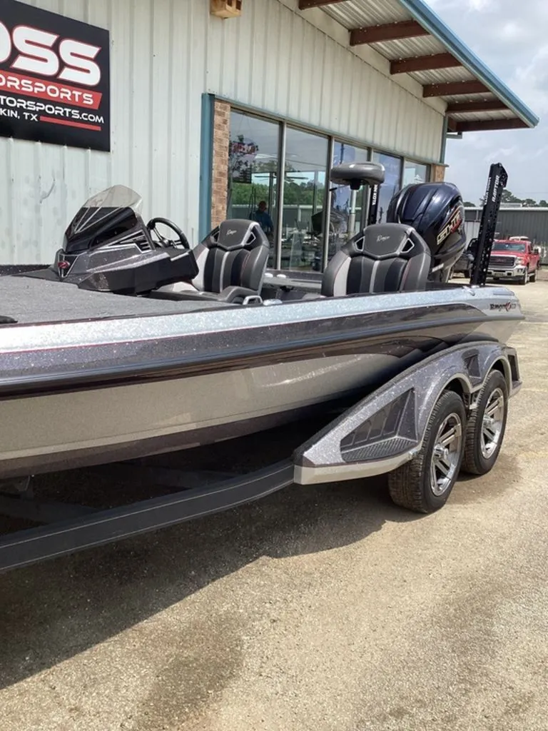 Slide: The Image of 2025 Ranger Z520R boat parked outside a building. - 12