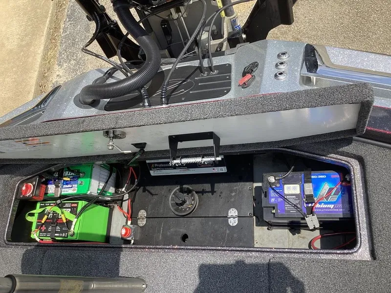 Slide: The Image of Battery compartment of 2025 Ranger Z520R with cables and connections. - 20