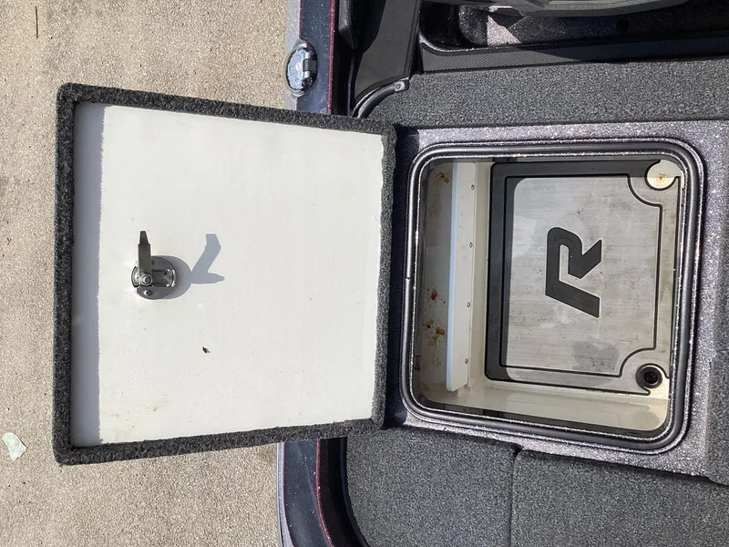Slide: The Image of Ranger Z520R 2025 storage compartment with open lid. - 23