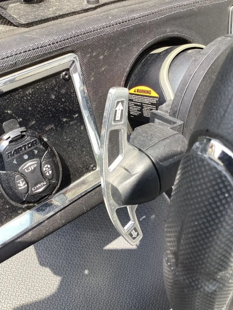 Slide: The Image of Interior of a 2025 Ranger Z520R with controls and paddle shifters. - 33