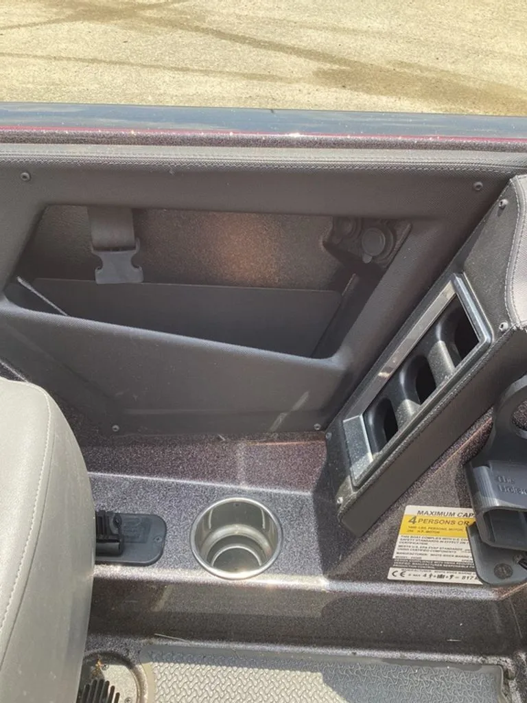 Slide: The Image of Interior of 2025 Ranger Z520R with cup holder and storage. - 38