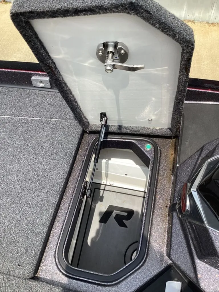 Slide: The Image of Ranger Z520R 2025 boat storage compartment with open lid. - 40