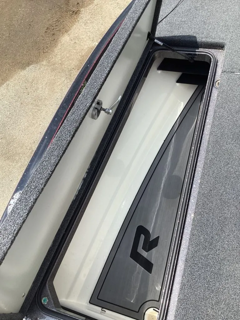 Slide: The Image of Open storage compartment of a 2025 Ranger Z520R boat. - 43