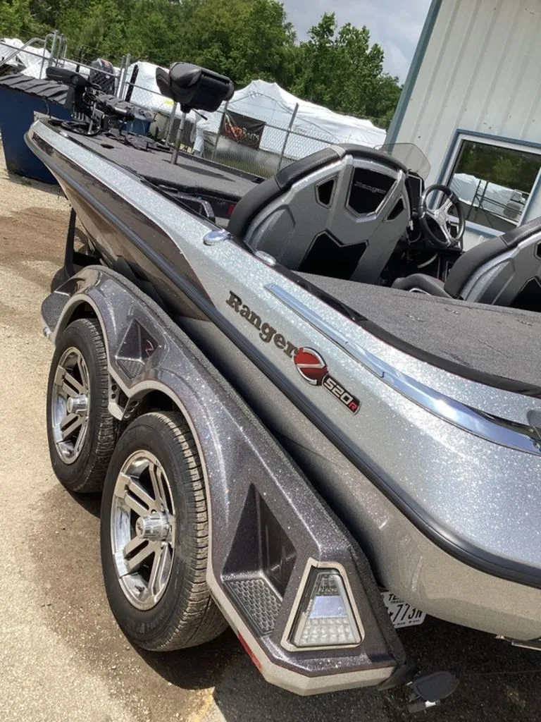 Slide: The Image of 2025 Ranger Z520R boat with shiny finish and dual axle trailer. - 7