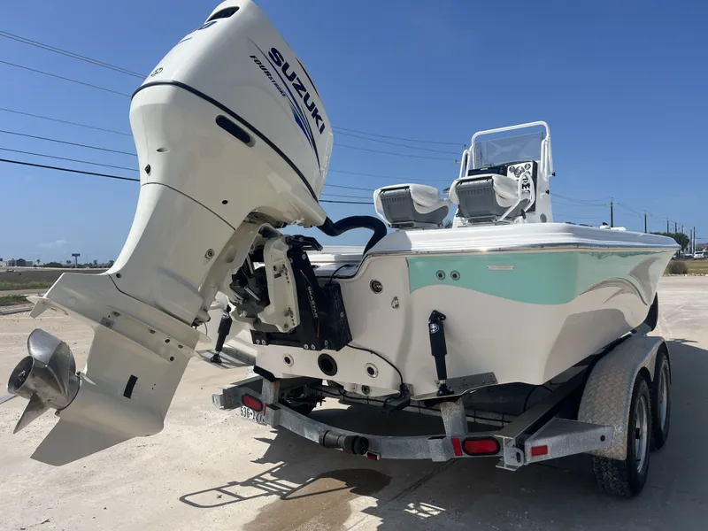 Slide: The Image of 2017 Blue Wave 2300 boat with Suzuki outboard motor on trailer. - 8