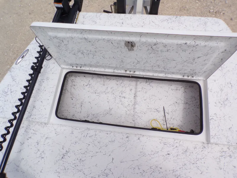 Slide: The Image of Open storage compartment on a 2024 Freedom 14 CHIQUITA boat. - 18