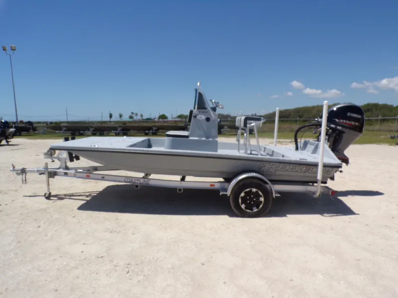 The Image of 2025 Freedom Eagle 16 boat on trailer outdoors. - 1