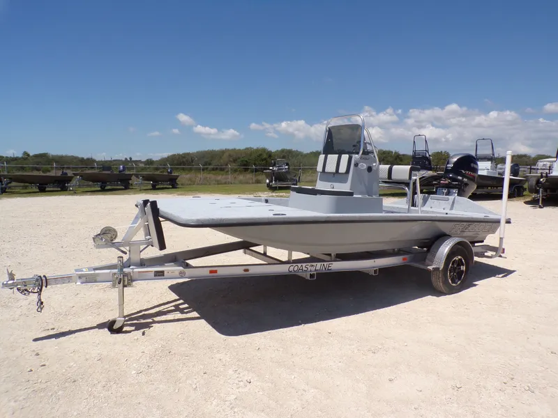 Slide: The Image of 2025 Freedom Eagle 16 boat on trailer outdoors. - 10