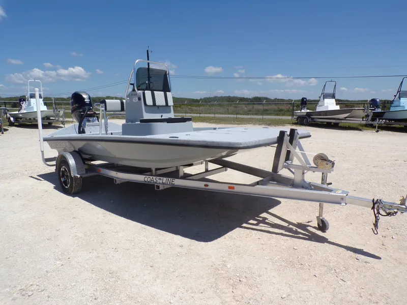 Slide: The Image of 2025 Freedom Eagle 16 boat on trailer in sunny weather. - 12