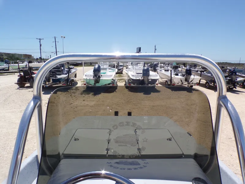 Slide: The Image of Freedom Eagle 16 boat from 2025 in a parking lot. - 28