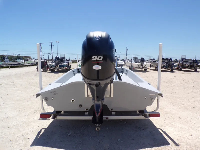 Slide: The Image of Rear view of 2025 Freedom Eagle 16 boat model with outboard motor. - 3